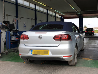 VW Golf Cabrio has front axle weighed at the start of ITV import test in Murcia VW Golf on weighscale at ITV